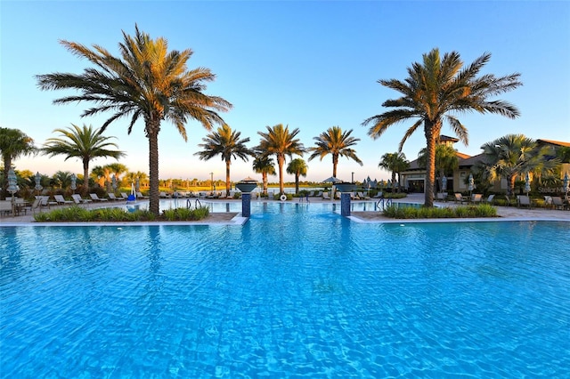 pool at dusk with a water view