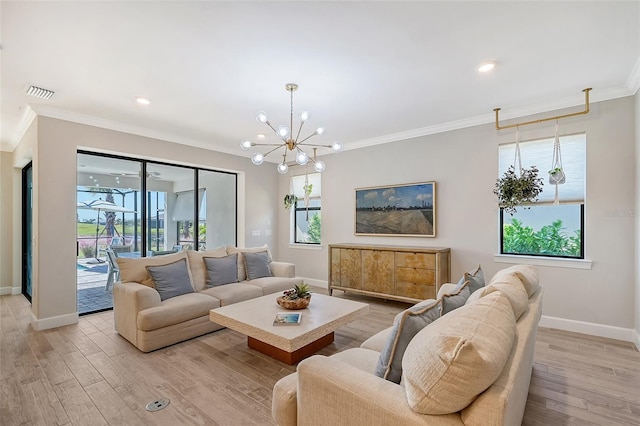 living room featuring crown molding, light hardwood / wood-style flooring, and a notable chandelier