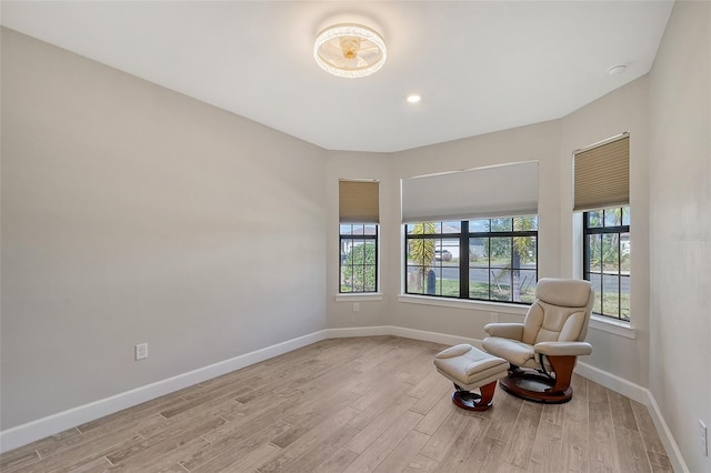 living area with light hardwood / wood-style floors