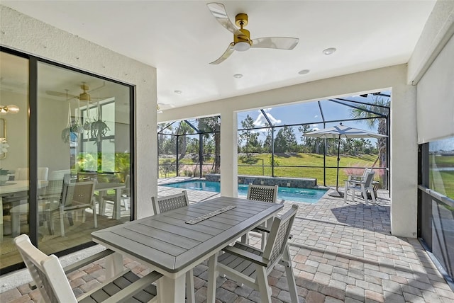 sunroom / solarium with a pool and ceiling fan