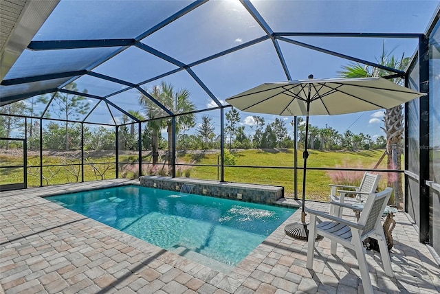 view of pool with a patio area, a lawn, pool water feature, and glass enclosure