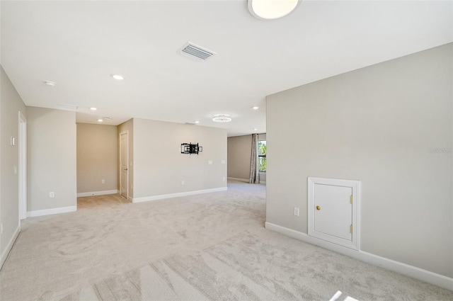 unfurnished room with light colored carpet