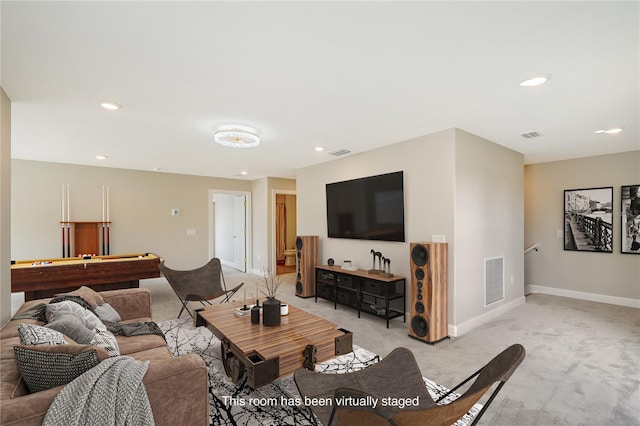 carpeted living room with pool table