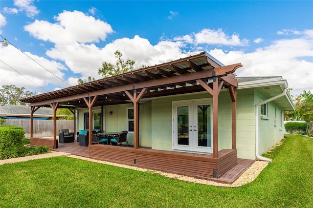 back of property featuring a patio area, a yard, french doors, and a pergola