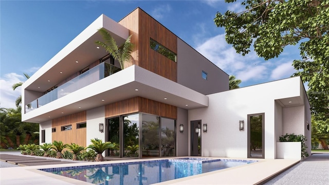 rear view of house featuring a balcony