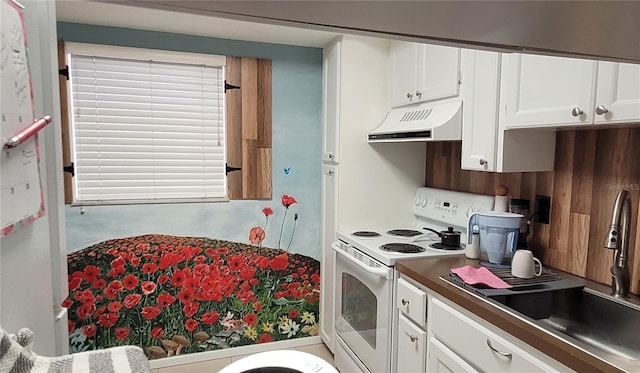 kitchen featuring white cabinets, white range with electric cooktop, and sink