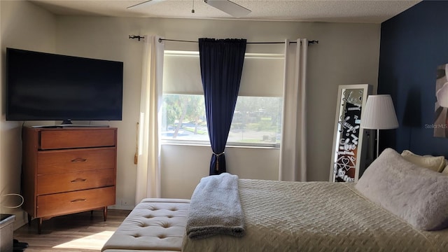 bedroom featuring light hardwood / wood-style flooring and ceiling fan