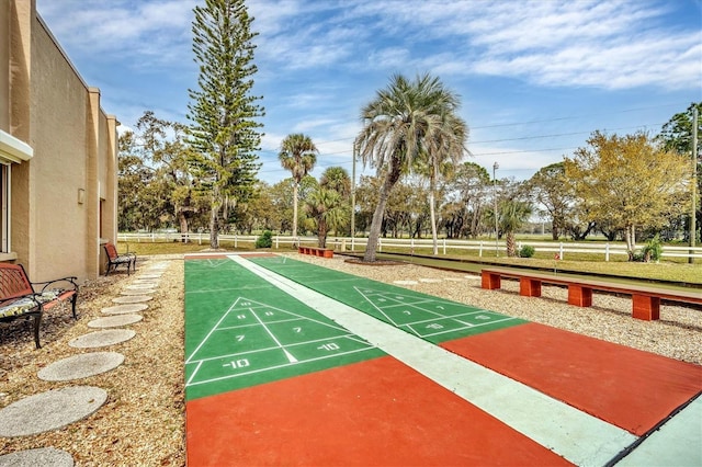 1540 Glen Oaks Dr E Unit B336, Sarasota, FL 34232 - view of community featuring shuffleboard, fence, and view of wooded area