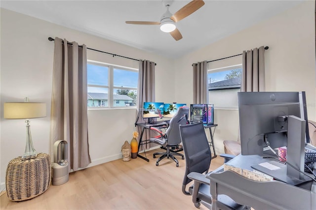 home office featuring ceiling fan and light hardwood / wood-style floors