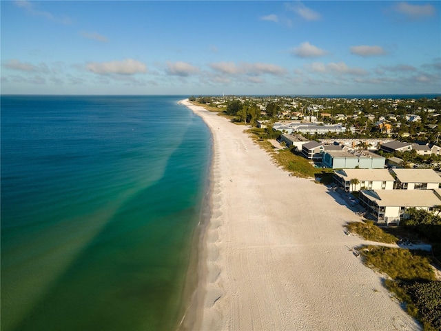 bird's eye view featuring a beach view and a water view