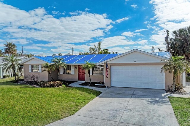 ranch-style home with a garage and a front lawn