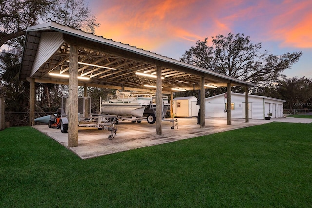 surrounding community featuring a lawn and an outdoor structure