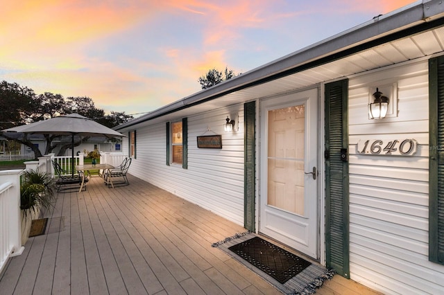 deck with outdoor dining area