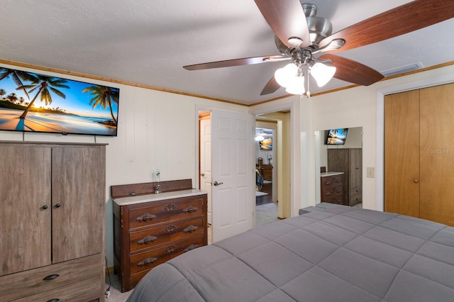 bedroom featuring a ceiling fan and visible vents