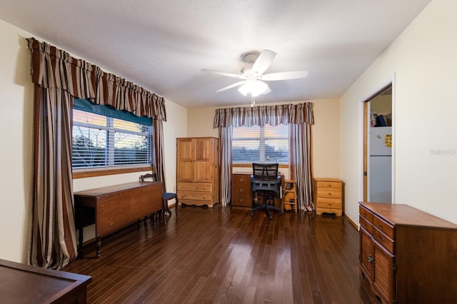 office with dark wood-type flooring and ceiling fan