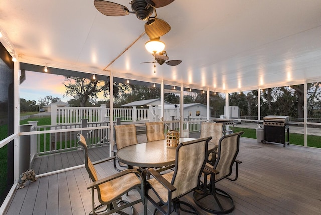 sunroom / solarium with ceiling fan