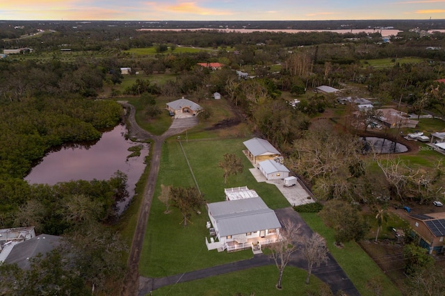 aerial view at dusk with a water view