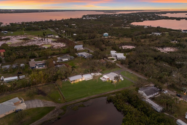 aerial view at dusk with a water view