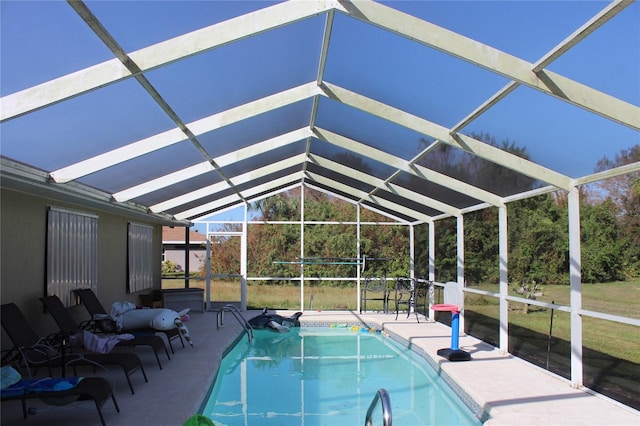 view of swimming pool with a patio and glass enclosure