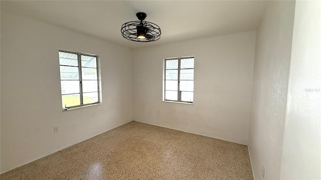 empty room featuring ceiling fan