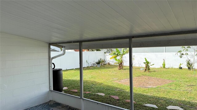 unfurnished sunroom with vaulted ceiling