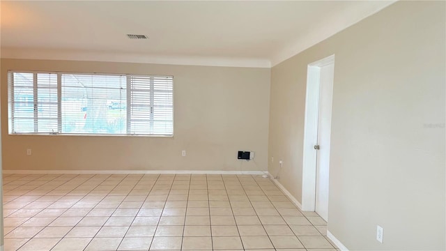 empty room featuring light tile patterned flooring