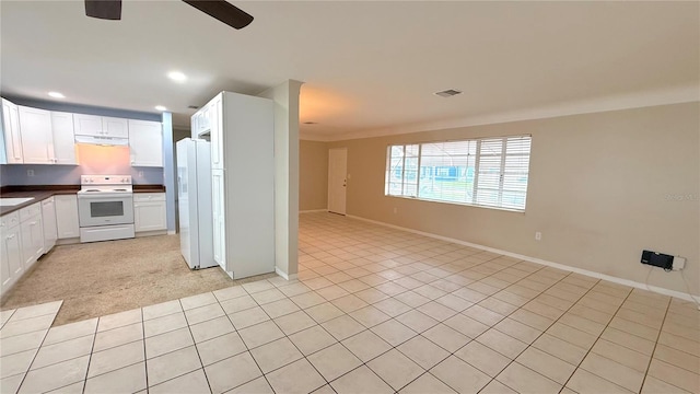 kitchen featuring white cabinetry, ceiling fan, white appliances, and range hood