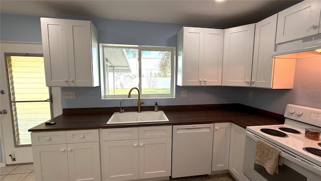 kitchen with white cabinetry and white appliances