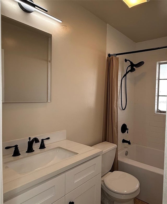 full bathroom featuring toilet, shower / bath combo, and vanity