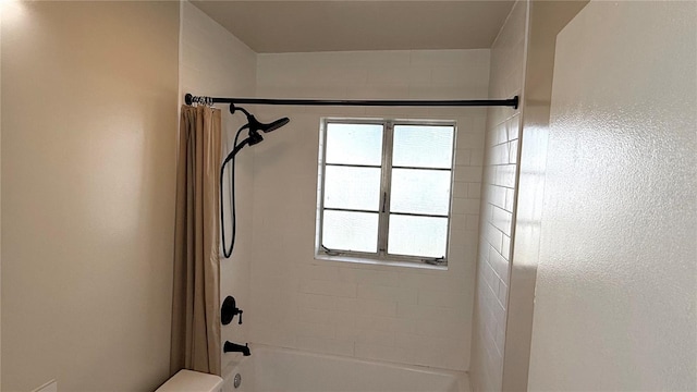 bathroom with shower / bath combo