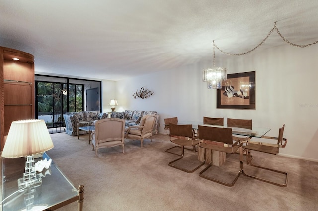 carpeted dining area with a textured ceiling and an inviting chandelier