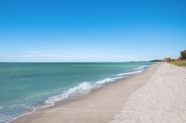 property view of water featuring a beach view