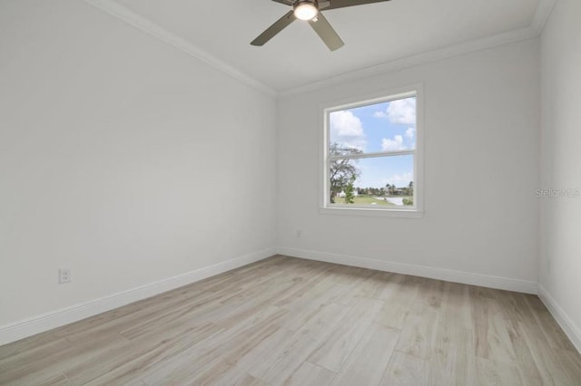 spare room featuring ornamental molding, ceiling fan, and light hardwood / wood-style floors