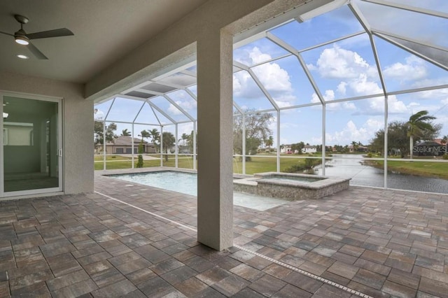 view of patio with a pool with hot tub, glass enclosure, and ceiling fan