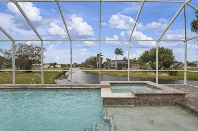 view of pool featuring glass enclosure, a water view, and an in ground hot tub