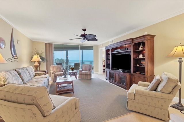 living room with expansive windows, ceiling fan, light colored carpet, and ornamental molding