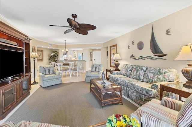 living room featuring ceiling fan and ornamental molding