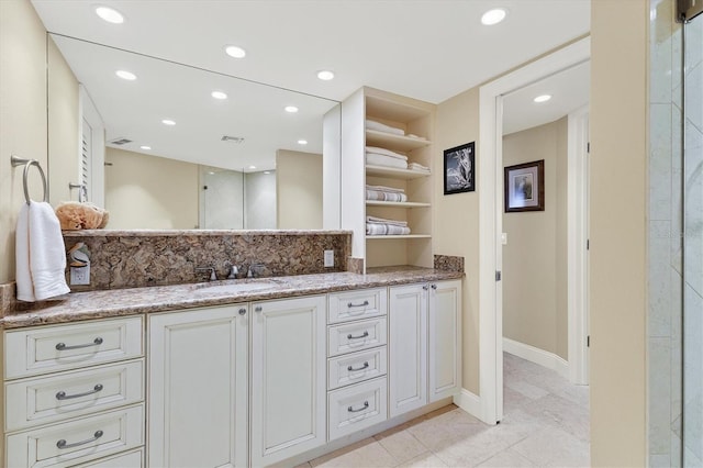 bathroom with vanity and tile patterned flooring