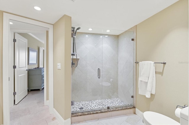 bathroom featuring toilet, tile patterned flooring, and walk in shower