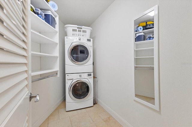 laundry room with light tile patterned floors and stacked washer and clothes dryer