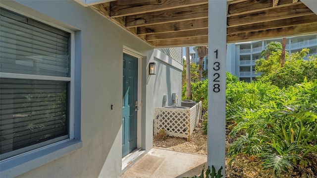 1328 Siesta Bayside Dr Unit 1328-C, Sarasota, FL 34242 - view of exterior entry featuring stucco siding