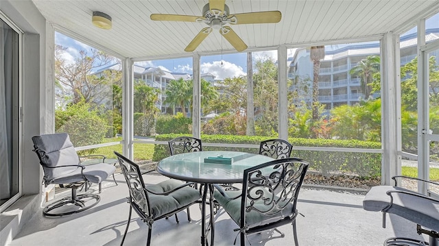 sunroom with ceiling fan and plenty of natural light