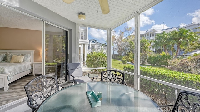 1328 Siesta Bayside Dr Unit 1328-C, Sarasota, FL 34242 - sunroom with ceiling fan, outdoor dining space, and a residential view