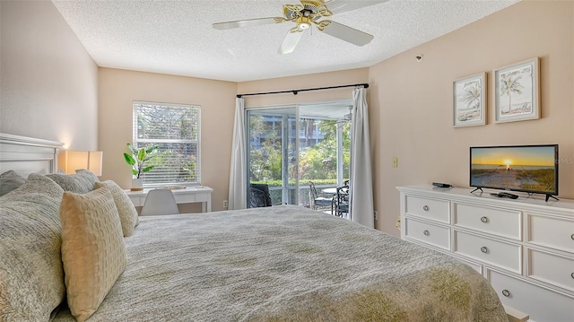 1328 Siesta Bayside Dr Unit 1328-C, Sarasota, FL 34242 - bedroom featuring access to outside, a textured ceiling, multiple windows, and a ceiling fan