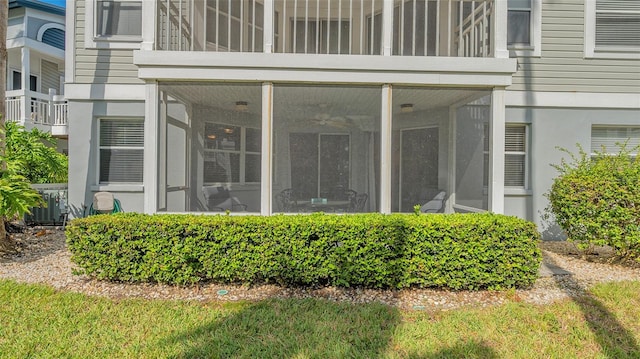 doorway to property with central air condition unit and a balcony