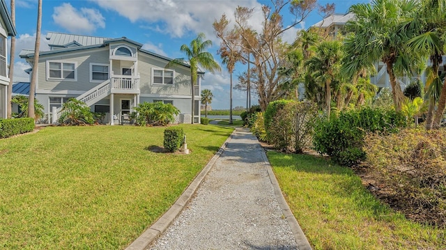 1328 Siesta Bayside Dr Unit 1328-C, Sarasota, FL 34242 - view of property's community with a lawn and stairway