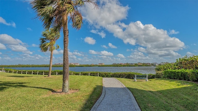 exterior space with a yard and a water view