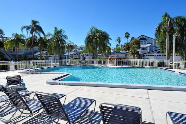 view of swimming pool featuring a patio area