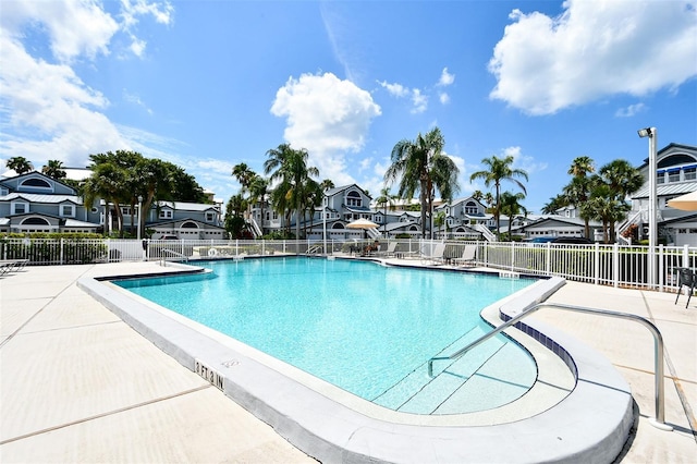 1328 Siesta Bayside Dr Unit 1328-C, Sarasota, FL 34242 - community pool featuring a residential view and a patio