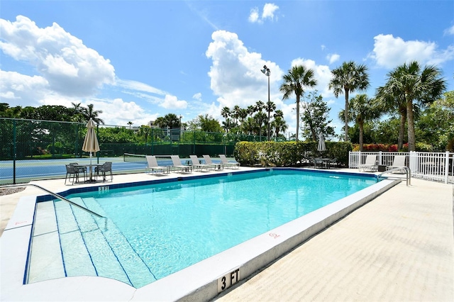1328 Siesta Bayside Dr Unit 1328-C, Sarasota, FL 34242 - community pool featuring a tennis court